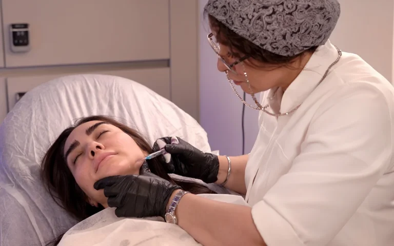 injecting filler to jaw of female patient