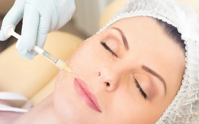 image of doctor performing mesotherapy with syringe on young woman's face